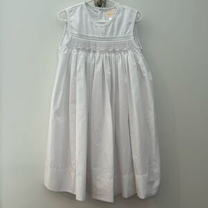 Petit Ami sleeveless white smocked dress